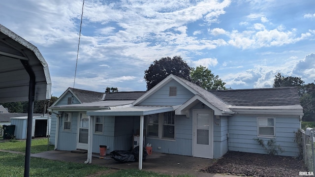926REAR S 19th St, Quincy, IL 62301 - back of house featuring a patio area, a storage shed, and a shingled roof