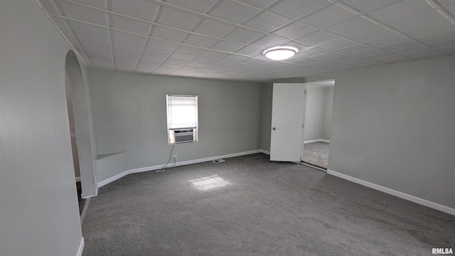 926REAR S 19th St, Quincy, IL 62301 - empty room featuring dark colored carpet, arched walkways, cooling unit, and a paneled ceiling