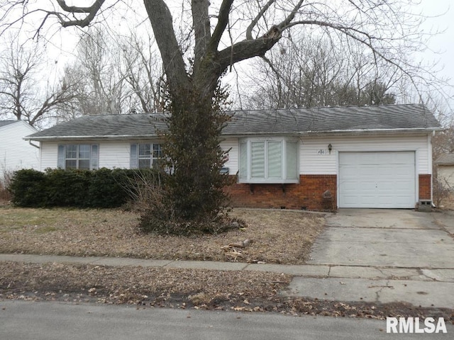 ranch-style house with a garage, concrete driveway, brick siding, and roof with shingles