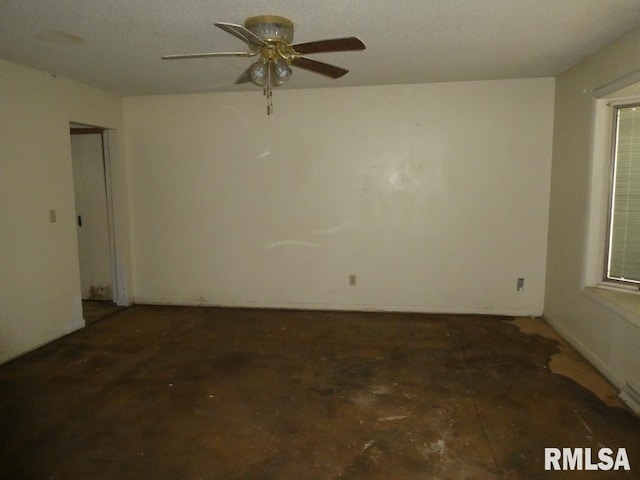 unfurnished room featuring a ceiling fan