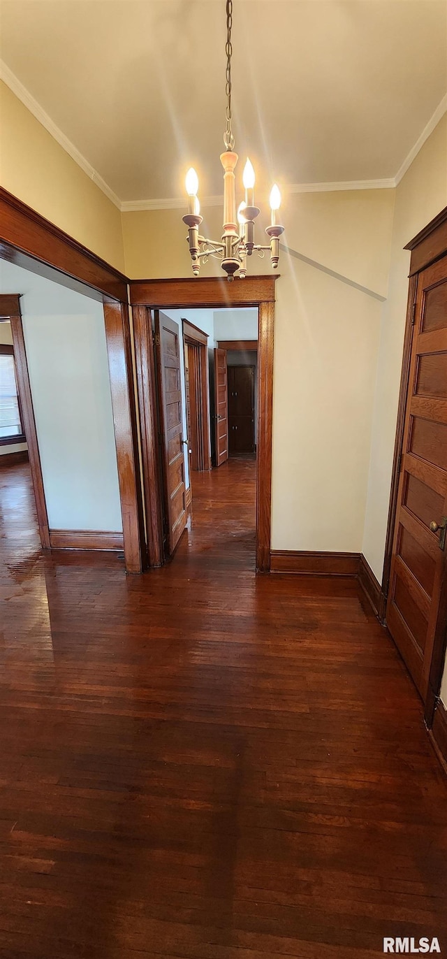 814 W Edwards St, Springfield, IL 62704 - unfurnished dining area with a chandelier, dark wood-style floors, ornamental molding, and baseboards