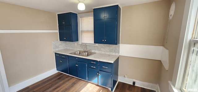 814 W Edwards St, Springfield, IL 62704 - kitchen with blue cabinetry, a sink, dark wood-style floors, and light countertops