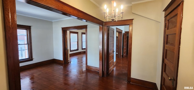 814 W Edwards St, Springfield, IL 62704 - hallway with a chandelier, baseboards, healthy amount of natural light, crown molding, and dark wood-style floors
