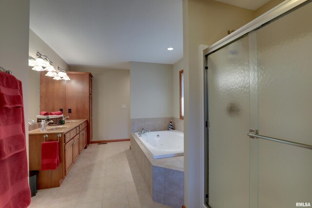 full bath with double vanity, a jetted tub, a sink, and a shower stall