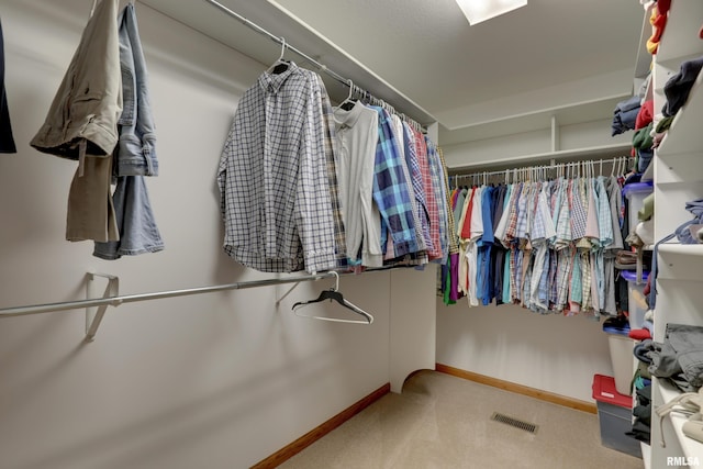 walk in closet with carpet and visible vents