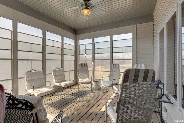 sunroom / solarium featuring ceiling fan