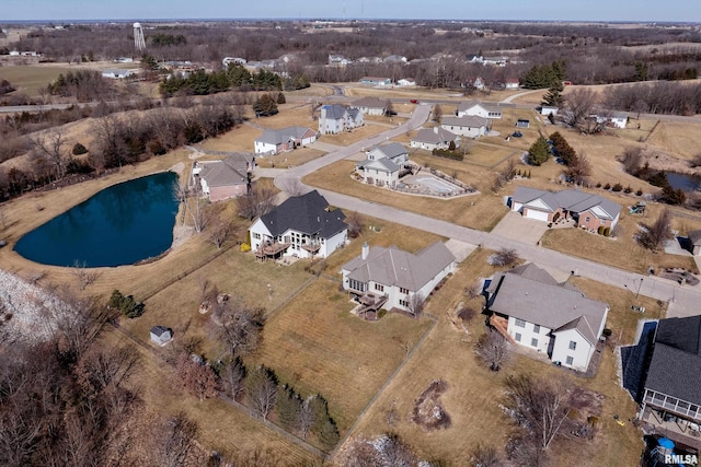 drone / aerial view featuring a water view and a residential view