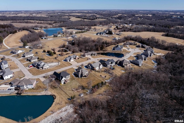 aerial view featuring a water view and a residential view