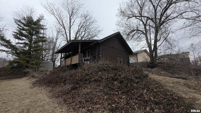 view of side of property featuring log siding