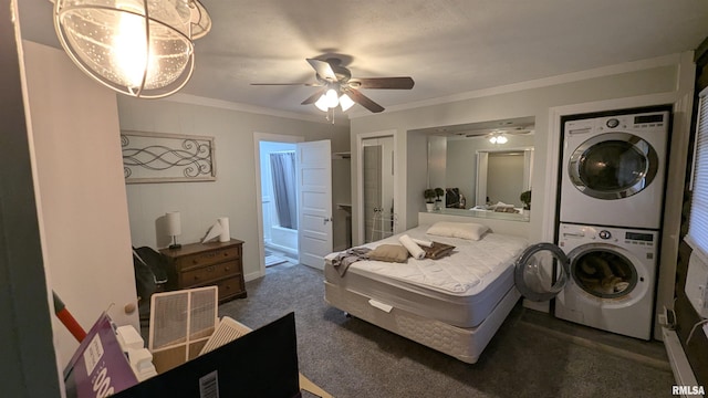 bedroom with carpet floors, ornamental molding, stacked washer and clothes dryer, and a ceiling fan