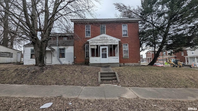 colonial house with brick siding