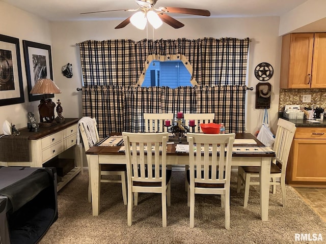 dining space with a ceiling fan