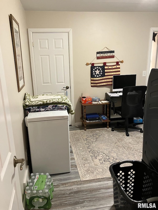 home office with wood finished floors