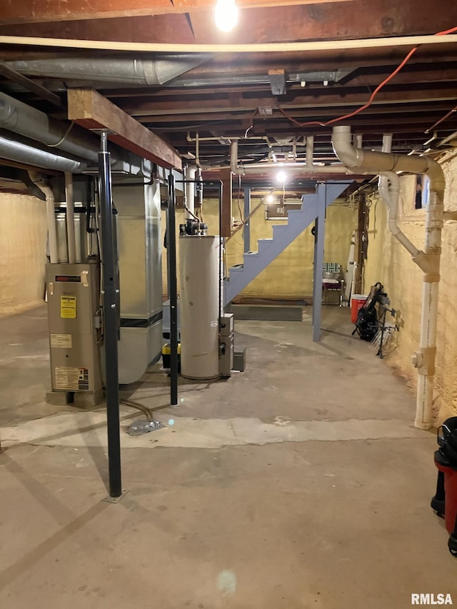 unfinished basement featuring water heater