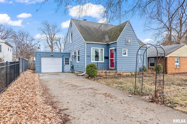 view of front of property with a garage, roof with shingles, fence, and driveway