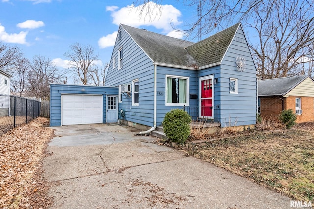 bungalow-style house with a garage, fence, concrete driveway, and roof with shingles