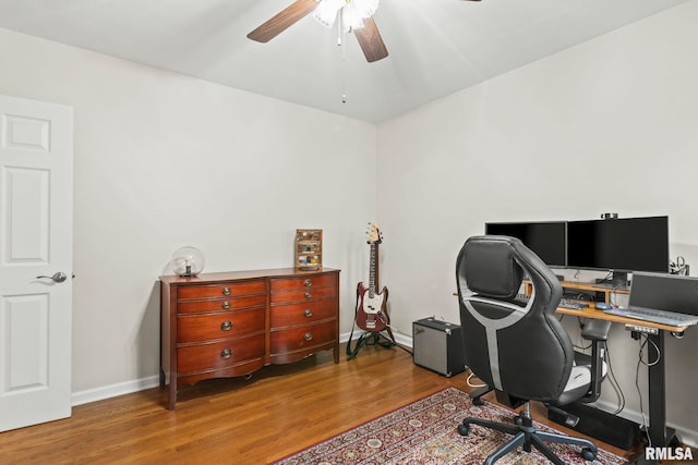 home office with ceiling fan, baseboards, and wood finished floors