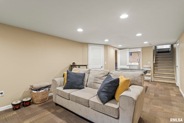 carpeted living area featuring recessed lighting, baseboards, and stairs