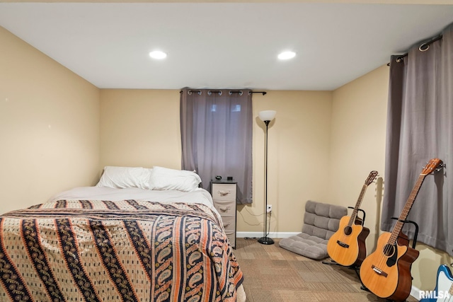 bedroom with recessed lighting, light colored carpet, and baseboards