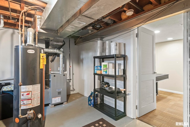 utility room featuring water heater and heating unit