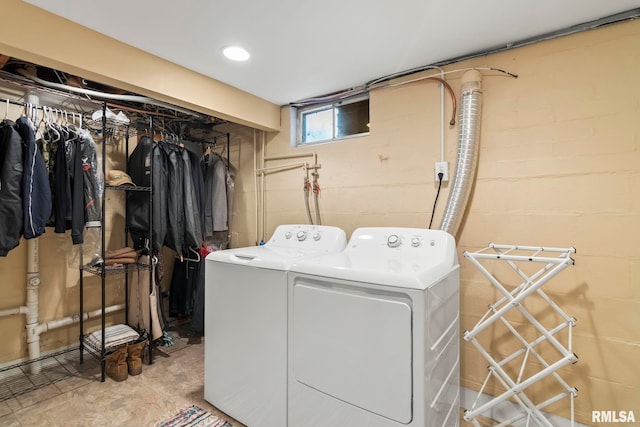 washroom with laundry area and washer and dryer