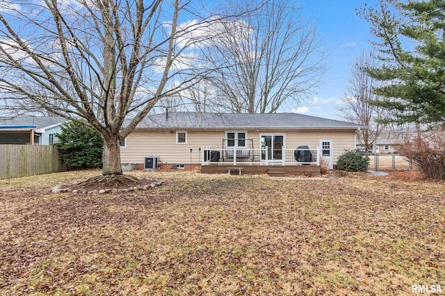 back of house featuring cooling unit, fence, and a deck