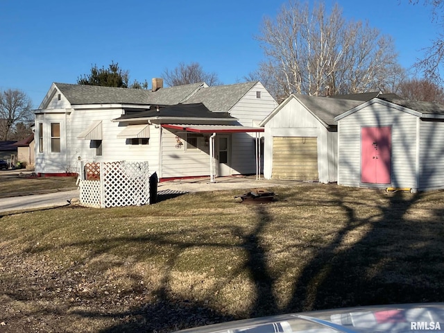 view of home's exterior featuring a lawn, a garage, and roof with shingles