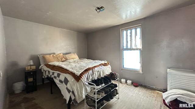 bedroom with wood-type flooring