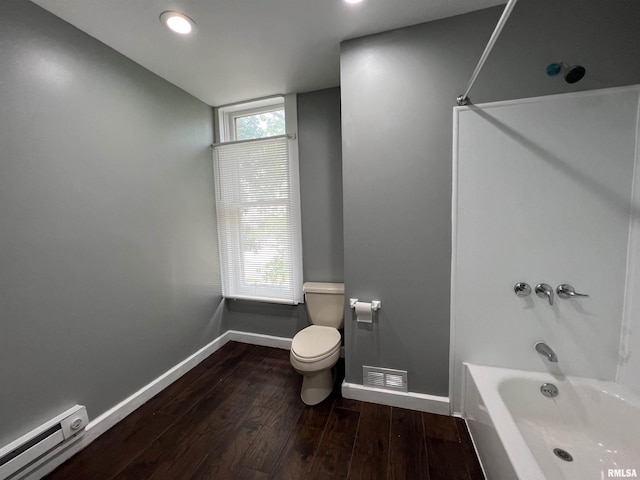 full bathroom with toilet, wood finished floors, washtub / shower combination, baseboards, and baseboard heating