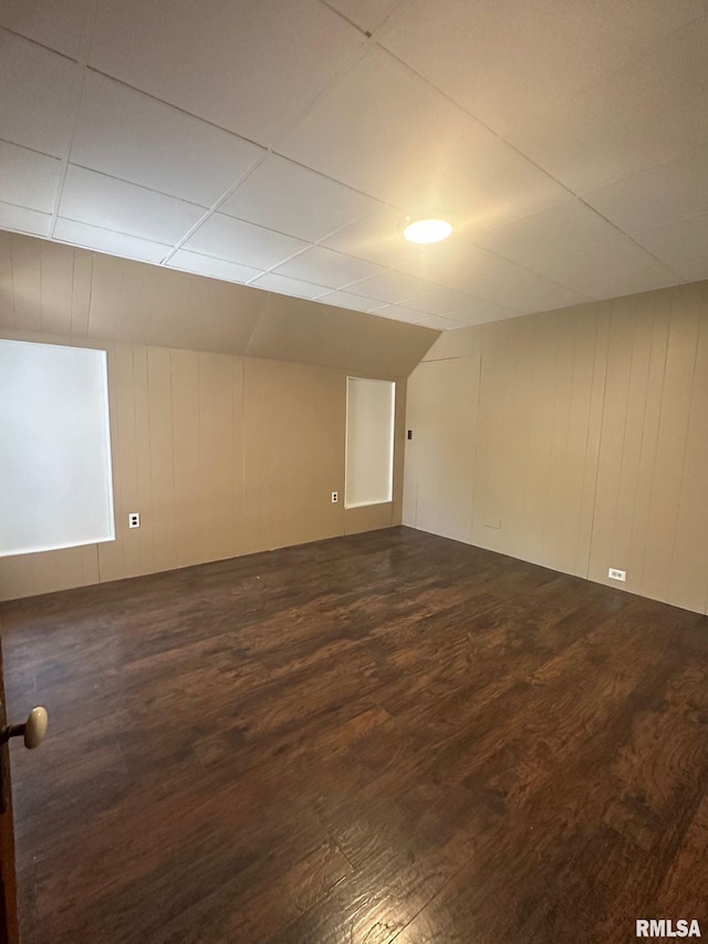 spare room with dark wood-type flooring