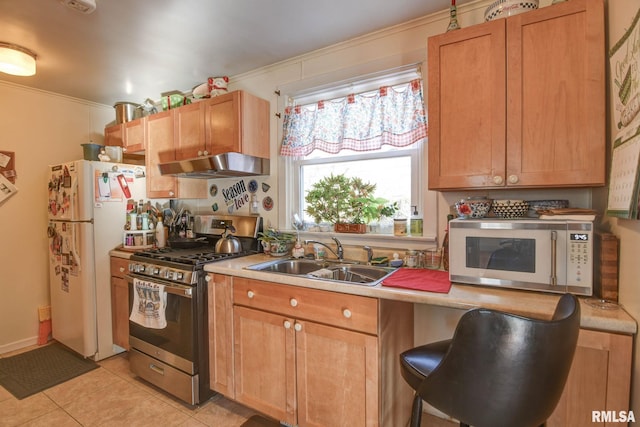 kitchen with white appliances, light tile patterned floors, a sink, light countertops, and exhaust hood