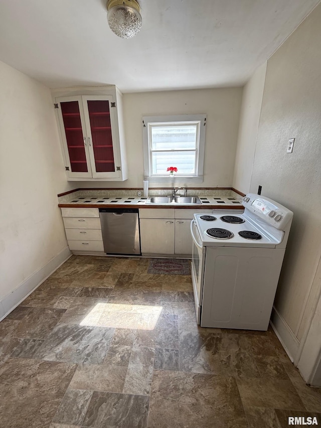 kitchen with baseboards, white electric stove, a sink, stone finish flooring, and dishwasher