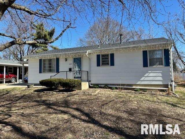 single story home featuring covered porch