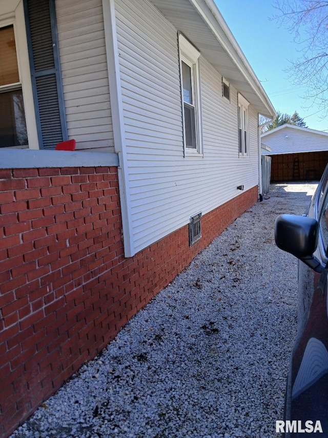 view of side of property with crawl space