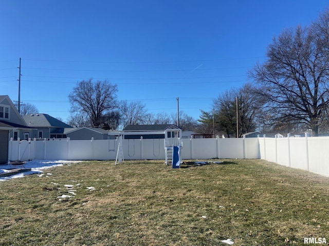 view of yard with a fenced backyard