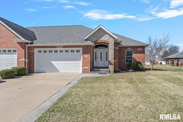 ranch-style house featuring brick siding, driveway, a front yard, and a garage