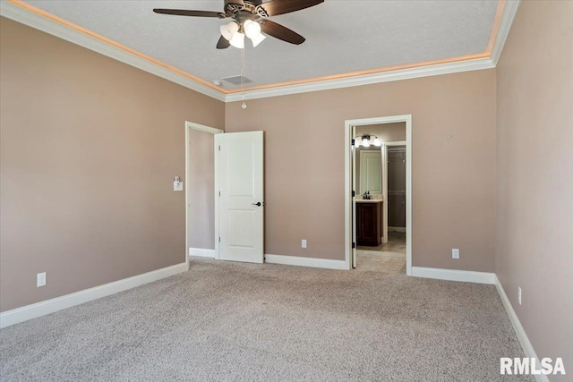 unfurnished bedroom with crown molding, carpet flooring, a ceiling fan, and baseboards