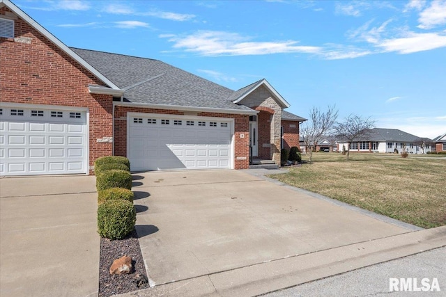 view of front of home with brick siding, a shingled roof, concrete driveway, a front yard, and an attached garage