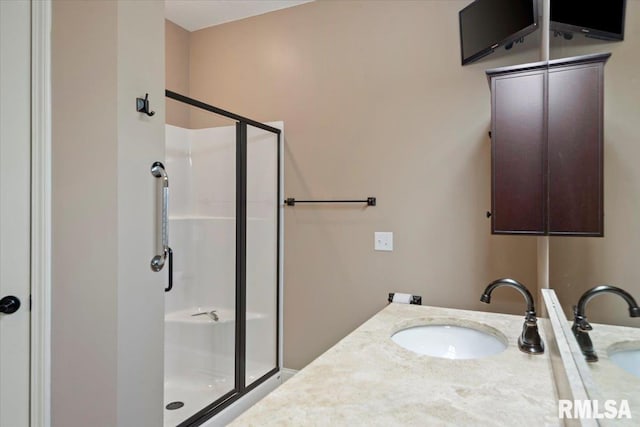 bathroom with vanity and a stall shower