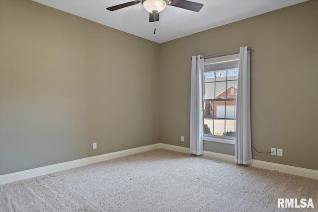 empty room with a ceiling fan, a healthy amount of sunlight, baseboards, and carpet floors