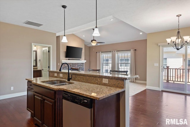 kitchen featuring visible vents, a sink, vaulted ceiling, stainless steel dishwasher, and ceiling fan with notable chandelier