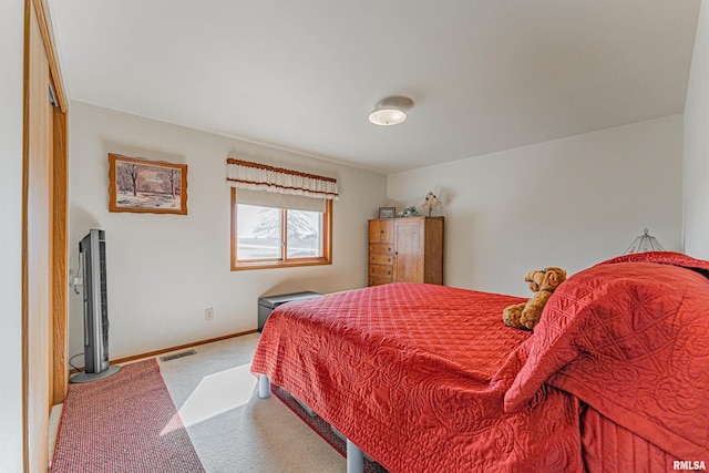 bedroom featuring carpet flooring, baseboards, and visible vents