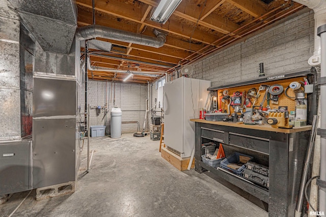 unfinished basement with heating unit and a workshop area