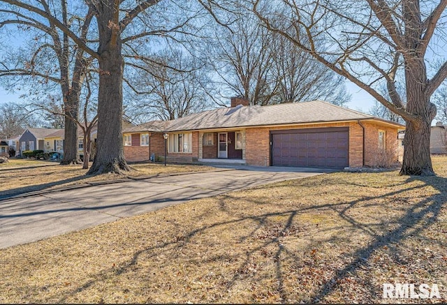 ranch-style house featuring concrete driveway, a garage, brick siding, and a chimney