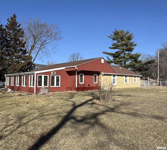 back of house featuring a yard