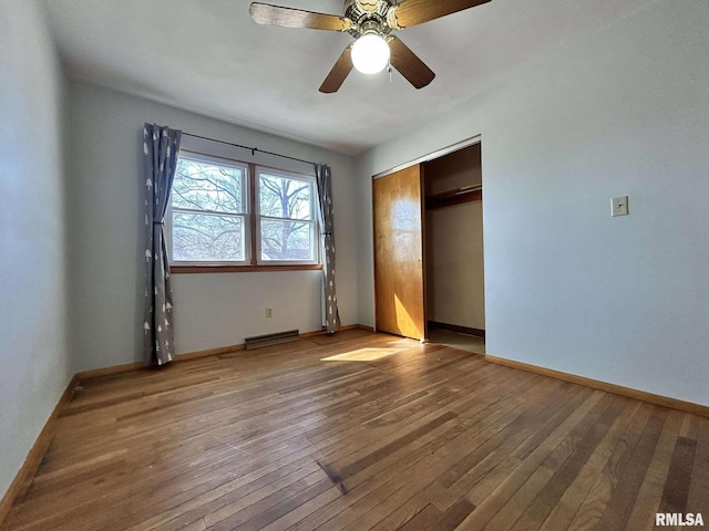 unfurnished bedroom featuring a closet, visible vents, light wood-type flooring, and baseboards