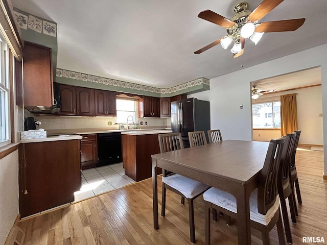 dining area with light wood-style floors