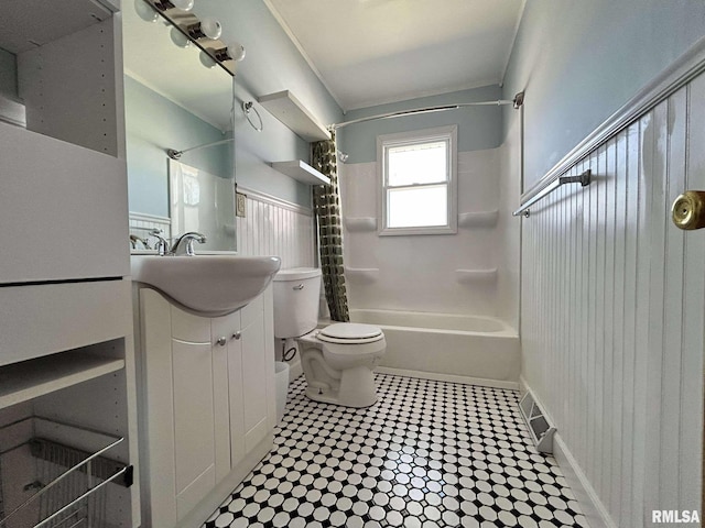 bathroom featuring toilet, shower / tub combo with curtain, ornamental molding, tile patterned floors, and vanity