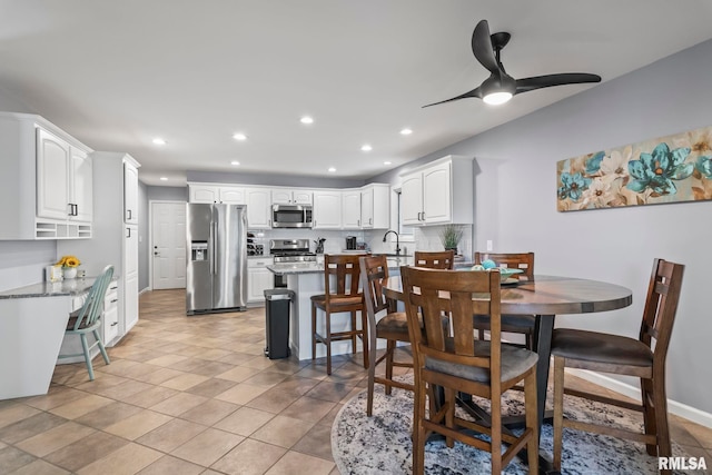 dining room with a ceiling fan, light tile patterned floors, recessed lighting, and baseboards