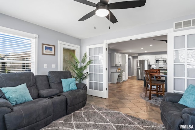 tiled living room featuring recessed lighting, a ceiling fan, visible vents, and french doors